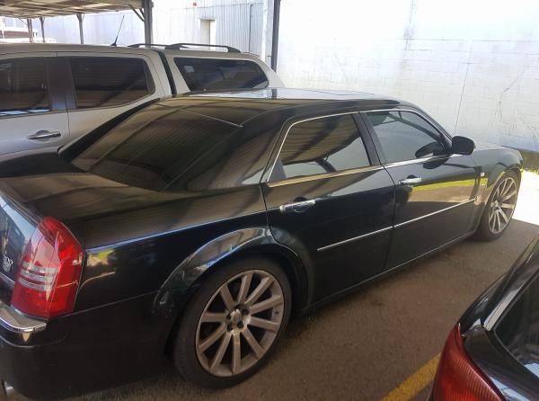 Tinting this large black sedan will help keep it cool in the summer and warm in the winter